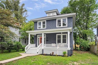 View of front of home with a porch and a front yard | Image 1