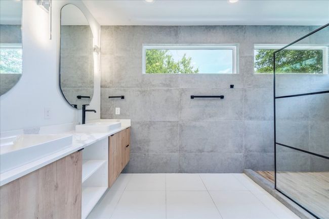 Full bath with double vanity, walk in shower, and tile patterned flooring | Image 15