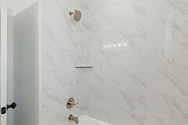Bathroom featuring shower / washtub combination | Image 15