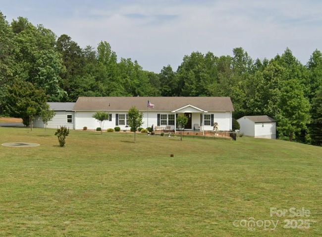 Manufactured Double-side Home exists on the property, along with 2- 30'x40' metal buildings. | Image 6