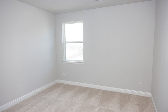 Empty room featuring light colored carpet and baseboards | Image 16