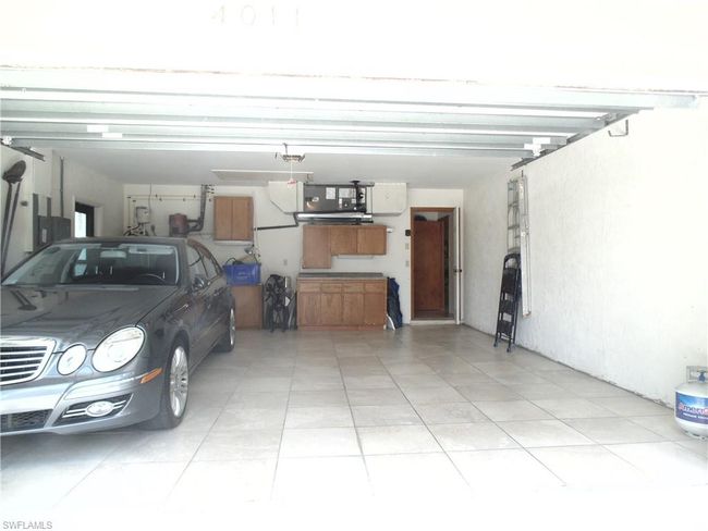 Garage with a garage door opener | Image 25