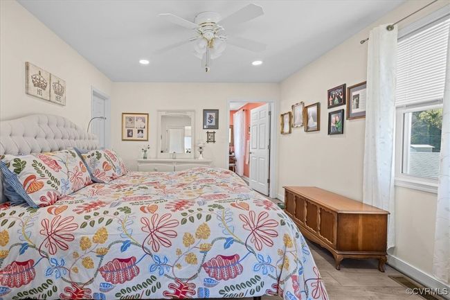 Light & brignt primary bedroom located on the 1st floor. Has glass doors that open to great room with awesome views of the river if you so desire! This is a King bed. | Image 18
