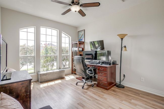 Home office featuring a ceiling fan and light wood-type flooring | Image 31