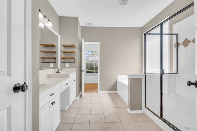 Bathroom with double vanity. | Image 15
