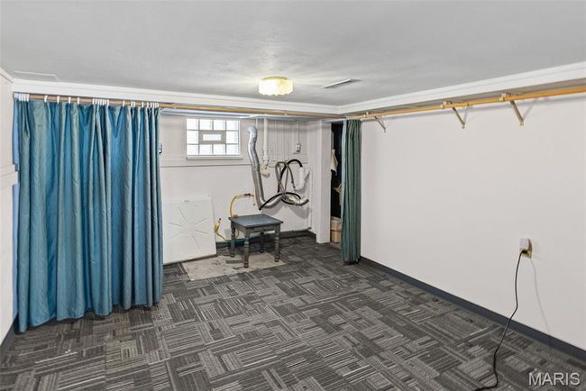 Basement with baseboards | Image 25
