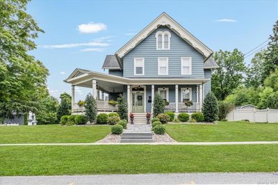 Curb appeal is an understatement! Extensive landscaping and bluestone walkway welcome you | Image 1