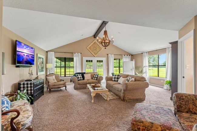 What a bonus! This is a great family room that has awesome versatility. Your family could definitely turn this into the game room, a large office, media room or anything your family needs! Full bathroom attached! | Image 23