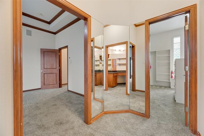 Primary bedroom also features a dressing area and a separate exercise or sitting space not shown in photo. | Image 17
