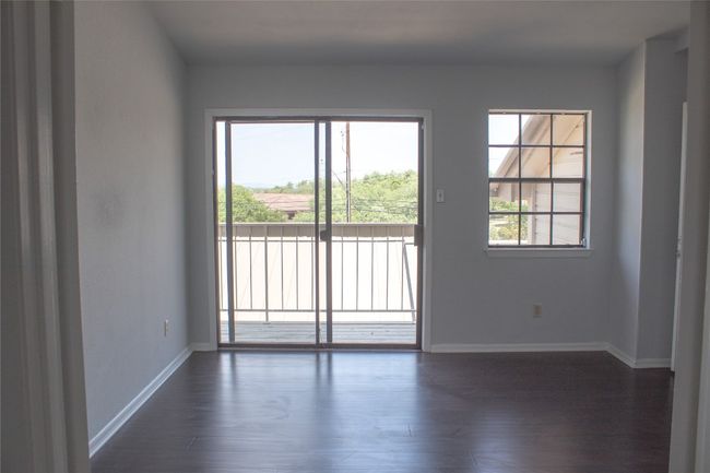 Empty room with baseboards and dark wood-type flooring | Image 22