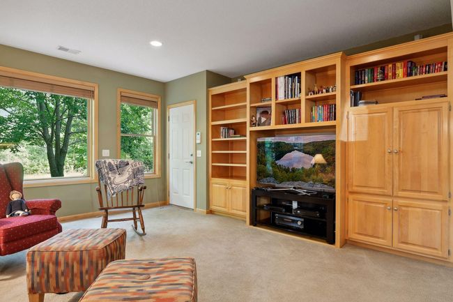 Enjoy seamless indoor-outdoor living with walkout access to a picturesque backyard and patio. | Image 26