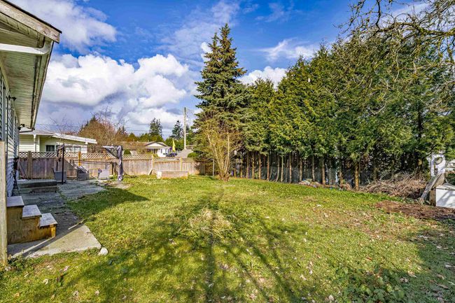 View of yard featuring fence | Image 15