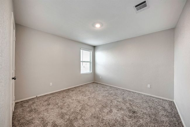 Carpeted spare room with baseboards | Image 22
