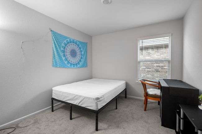 Bedroom with light carpet and baseboards | Image 21