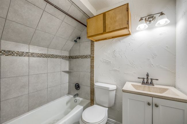 Bathroom with vanity and tub / shower combination | Image 22
