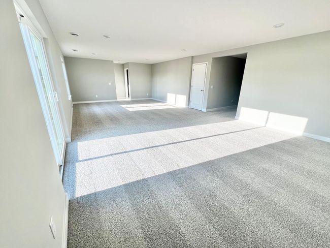 Actual home: Walkout lower level with finished family room gives you even more living space, 4054 sq ft to be exact! An unfinished BR & BA (already equipped with electrical & plumbing rough-ins) would give you a 5th bedroom and 4th bathroom! | Image 37