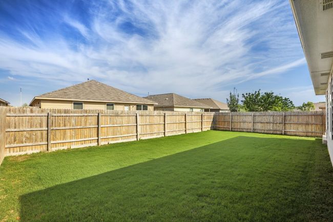 View of fenced backyard | Image 31