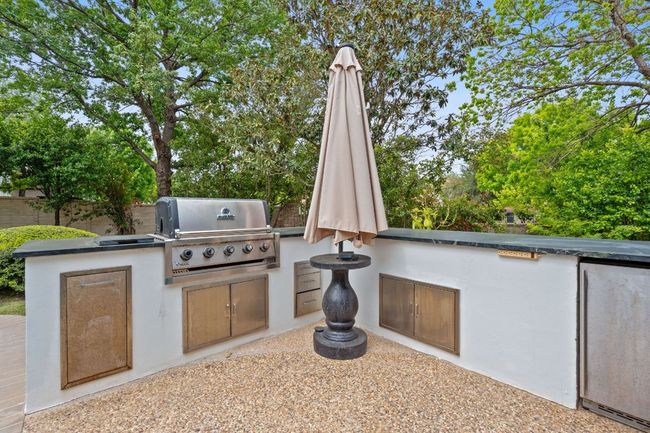 Outdoor kitchen with gas grill and outdoor entertaining | Image 35