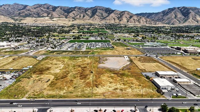 Aerial view of property and surrounding area with a mountainous background | Image 24