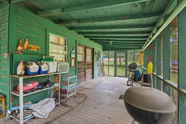 Sunroom / solarium featuring beam ceiling | Image 21