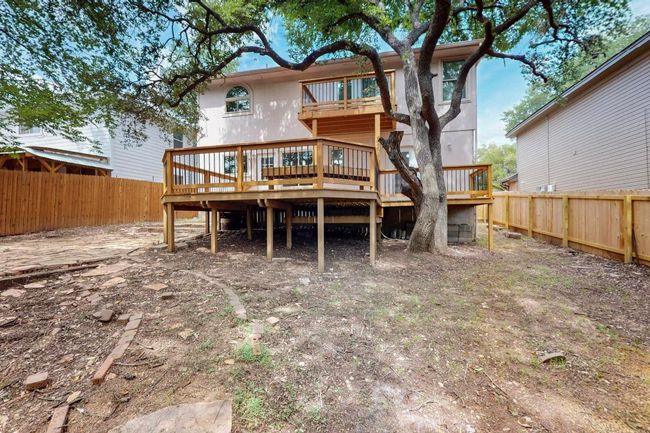 Rear view of house featuring a deck, a fenced backyard, and a​​‌​​​​‌​​‌‌​‌‌​​​‌‌​​‌‌​‌​​​​​‌ balcony | Image 30