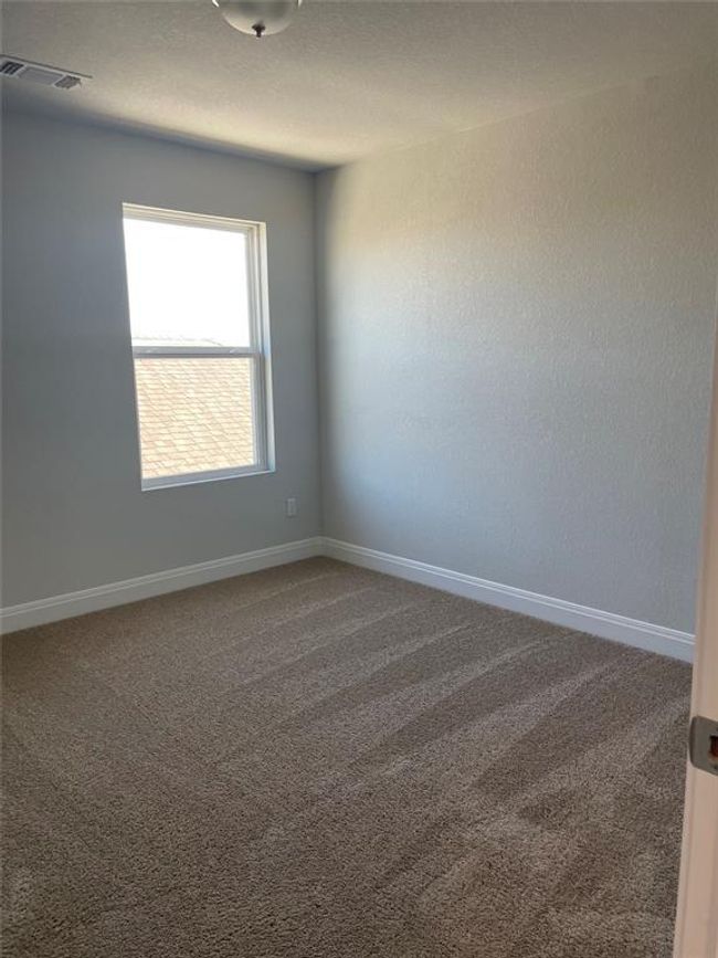 Carpeted spare room with baseboards | Image 22
