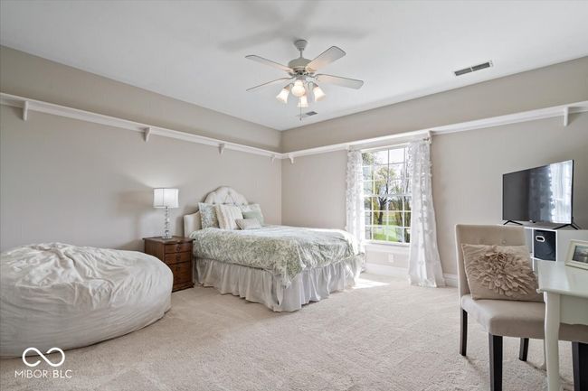 Upstairs bedroom #2 features a private bathroom and walk-in closet. | Image 34