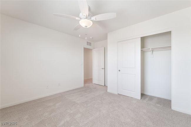 Unfurnished bedroom with carpet, a closet, and ceiling fan | Image 31
