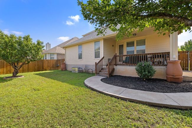 Back of property with a porch and rain catchers | Image 29