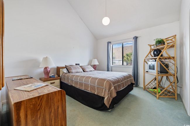 Carpeted bedroom with vaulted ceiling | Image 9
