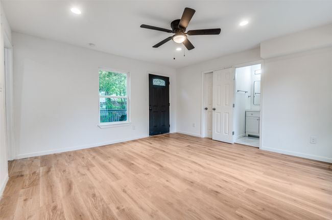 Unfurnished bedroom with baseboards, light wood finished floors, and recessed lighting | Image 17