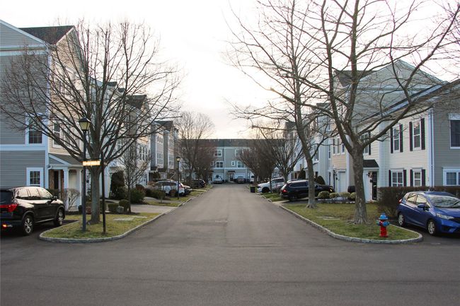 View of road with a residential view, curbs, and street lighting | Image 29