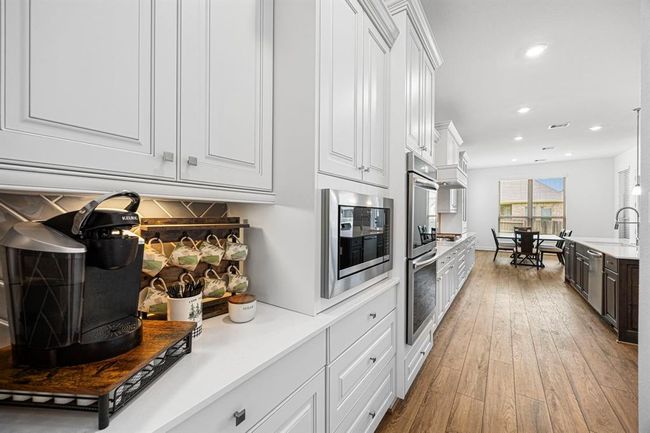 Kitchen offers plenty of counter space for your coffee bar. | Image 23