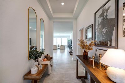 Welcome home as your beautiful entryway greets you with a tray ceilings and recessed lighting. | Image 1