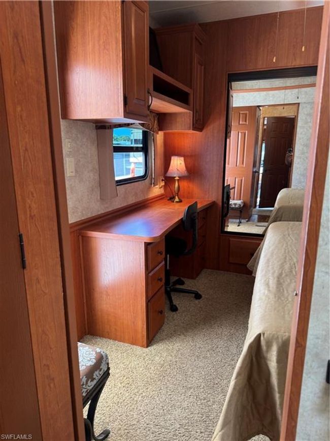 Home office featuring built in desk | Image 14