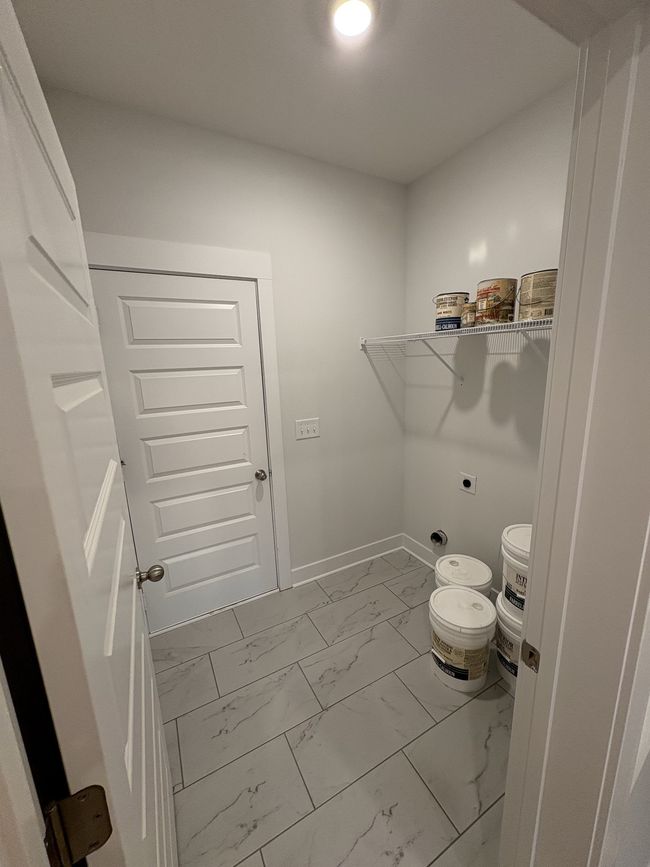 STOCK PHOTO. SELECTIONS WILL VARY IN ACTUAL HOUSE. Laundry room w/ tile flooring. | Image 11