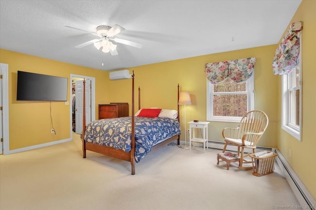 Primary en-suite bedroom with walk-in closet, full bathroom, and dressing room or second walk-in closet. | Image 15