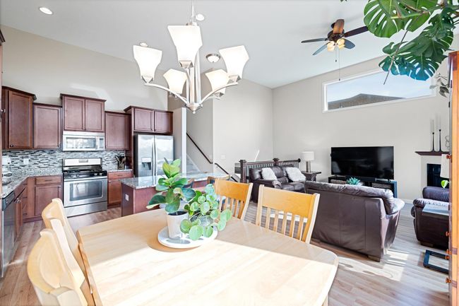 Open concept with great flow from kitchen to living to dining. Huge windows and soaring ceilings let in all the natural light. | Image 9