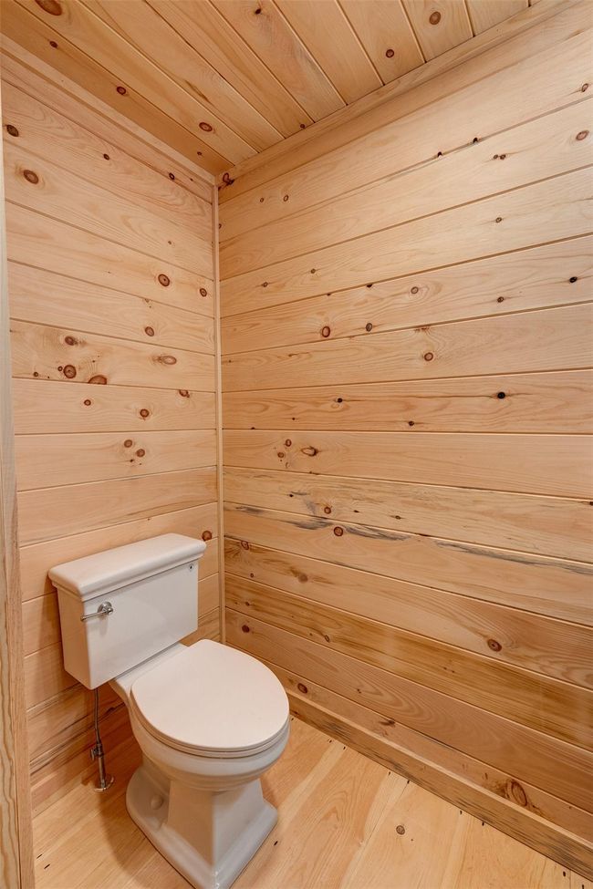 Bathroom with toilet and wood finished floors | Image 27