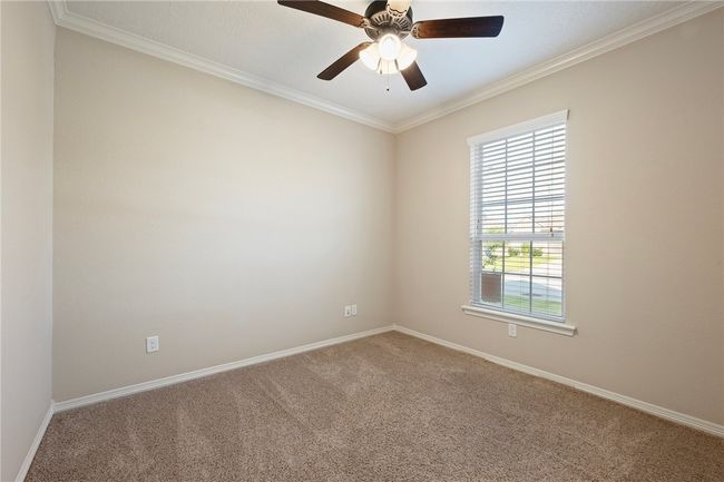 Unfurnished room with carpet flooring, ornamental molding, and ceiling fan | Image 18
