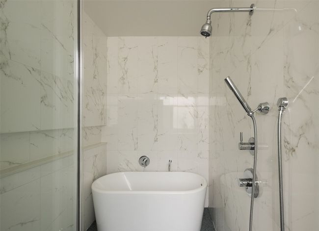 Full bath featuring a freestanding bath and a marble finish shower | Image 31