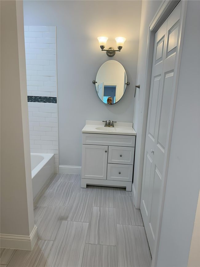 Full bathroom featuring vanity and baseboards | Image 18