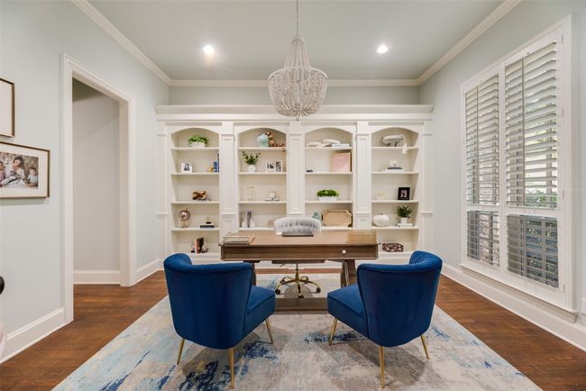 Office space with a chandelier, ornamental molding, wood finished floors, and recessed lighting | Image 16