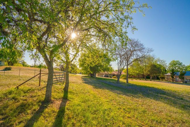 View of yard featuring a rural view and fence | Image 27