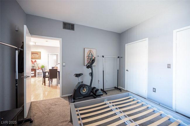 Workout area with carpet flooring and visible vents | Image 26