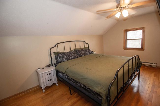 Generous owner's bedroom - also boasting hardwood floors. | Image 17