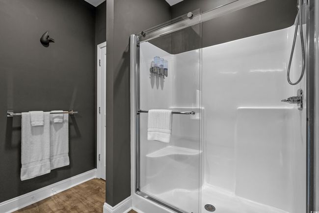 Bathroom with a shower stall and wood finished floors | Image 20