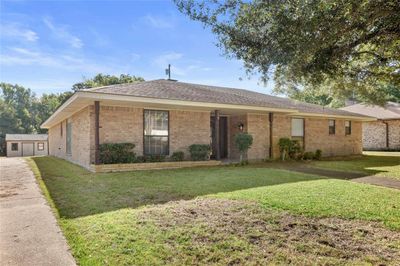 Single story home featuring a front yard | Image 1