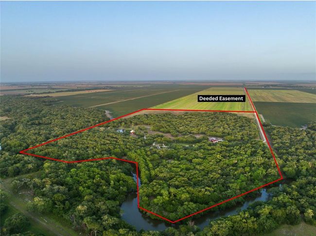 Embraced by sprawling tracts of substantial land, the A&W Ranch enjoys an unparalleled level of privacy. A sense of true seclusion prevails as the property is discreetly nestled amidst these substantial parcels. Access to this haven is facilitated through a deeded easement originating from FM 1862. The homestead itself rests at a distance of approximately 1.6 miles from FM 1862. | Image 11