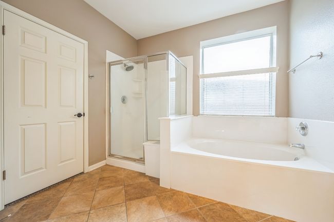 Full bathroom with a bath and a shower stall | Image 17